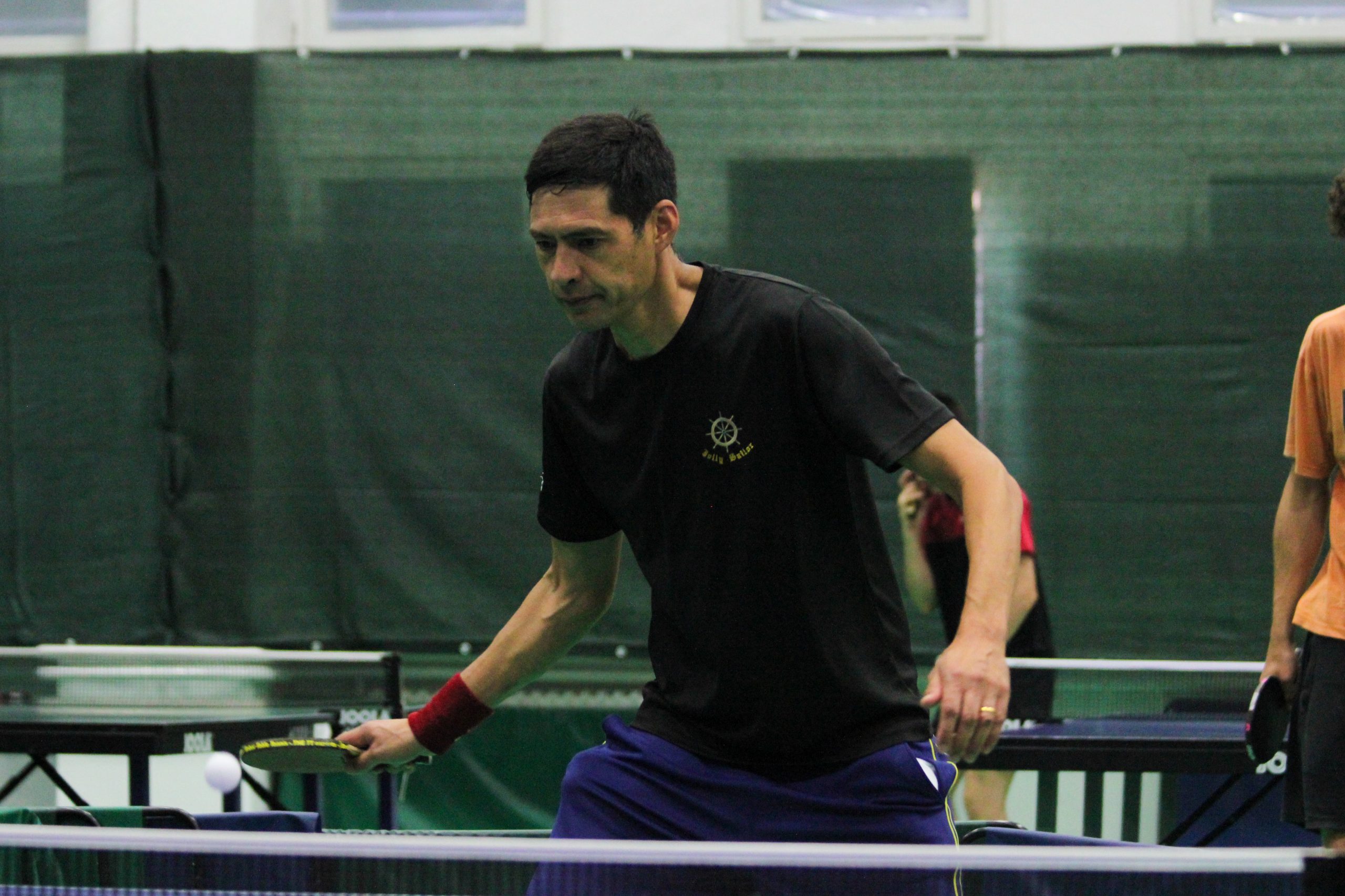 Simon playing table tennis at The Kenfig Club